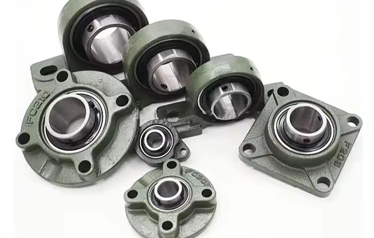 A professional collection of mounted pillow block bearing units featuring various cast iron housings like UCF square, UCFC round, and UCP pillow block styles with high-carbon chrome steel insert bearings.