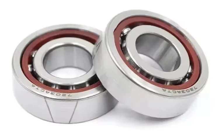 A pair of high-precision angular contact ball bearings featuring specialized cages, engineered for high-speed operation, low friction, and simultaneous radial/axial load capacity in CNC machinery, robotics, and industrial automation.