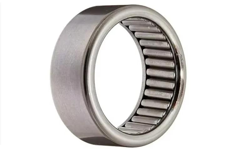 A high-precision drawn cup needle roller bearing with an integrated cage, engineered for extreme dynamic radial load and smooth motion in space-constrained industrial transmission systems.