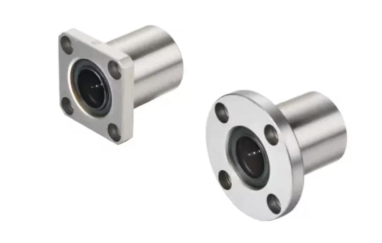 3D render showing a custom LMK series square flanged linear bearing (left) and an LMF series round flanged linear bearing (right), both with internal recirculating balls and synthetic retainers, designed for stable bolt-on linear motion.